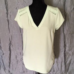 Mint colored polyester blouse.